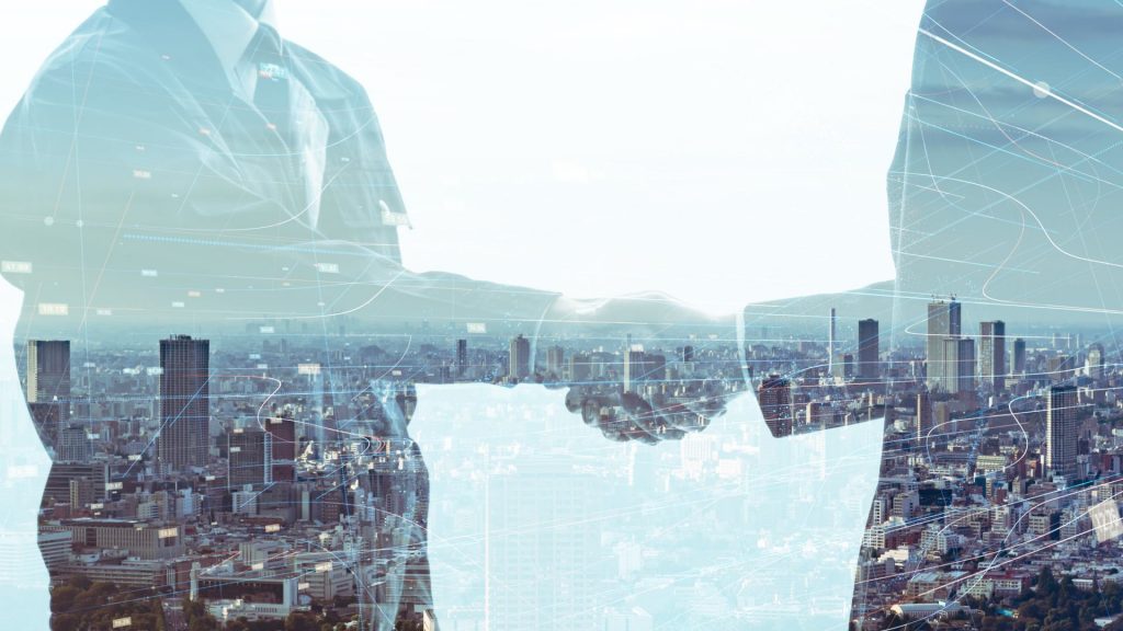 Riscreen auf der Automatica Messe: Businessleute schütteln Hände